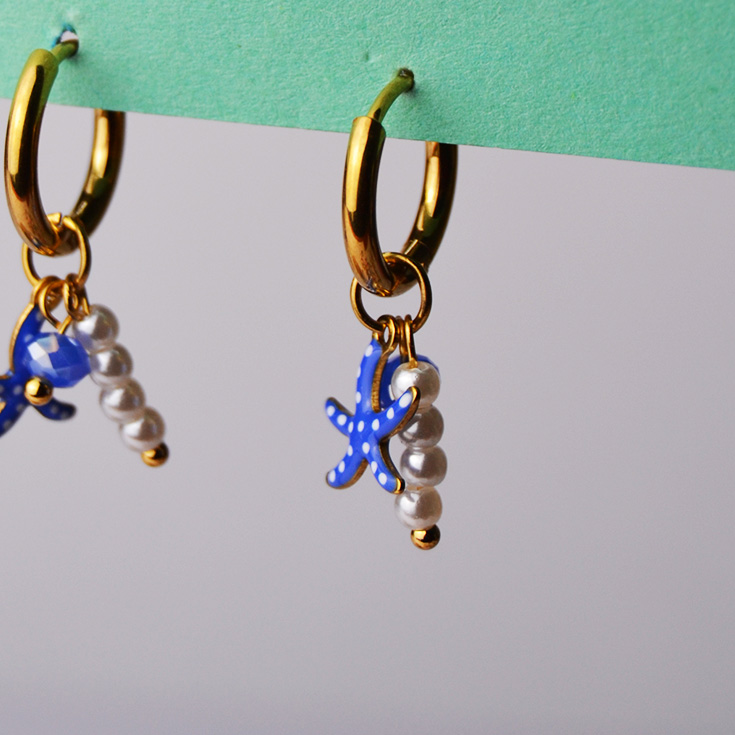 pendientes aritos dorados charm estrella de mar azul