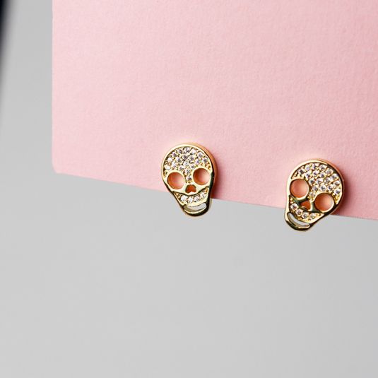 pendientes de boton calavera dorados con circonitas blancas