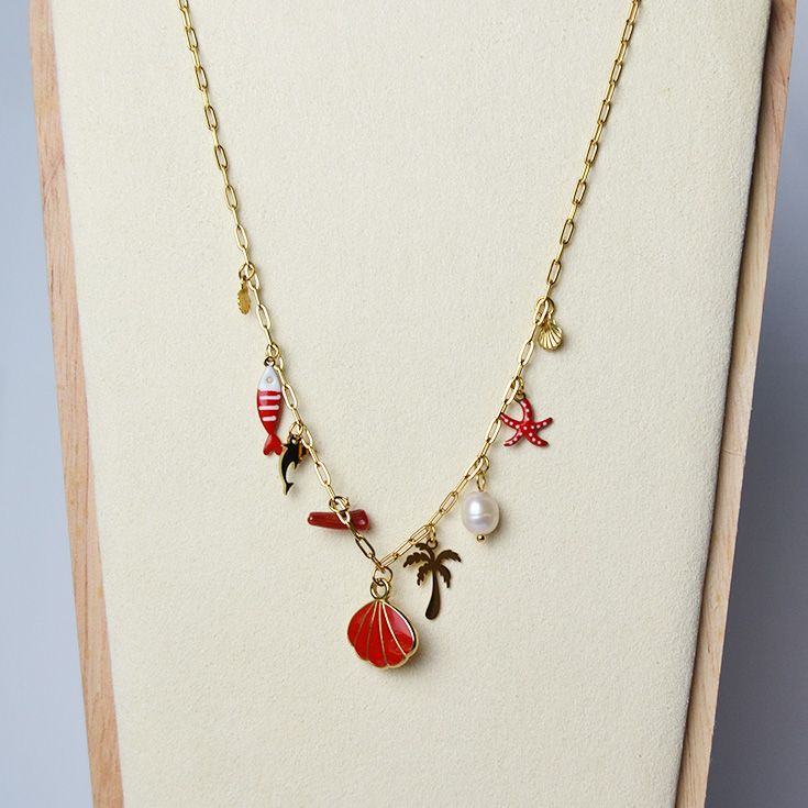 collar dorado con concha roja collar dorado con concha roja