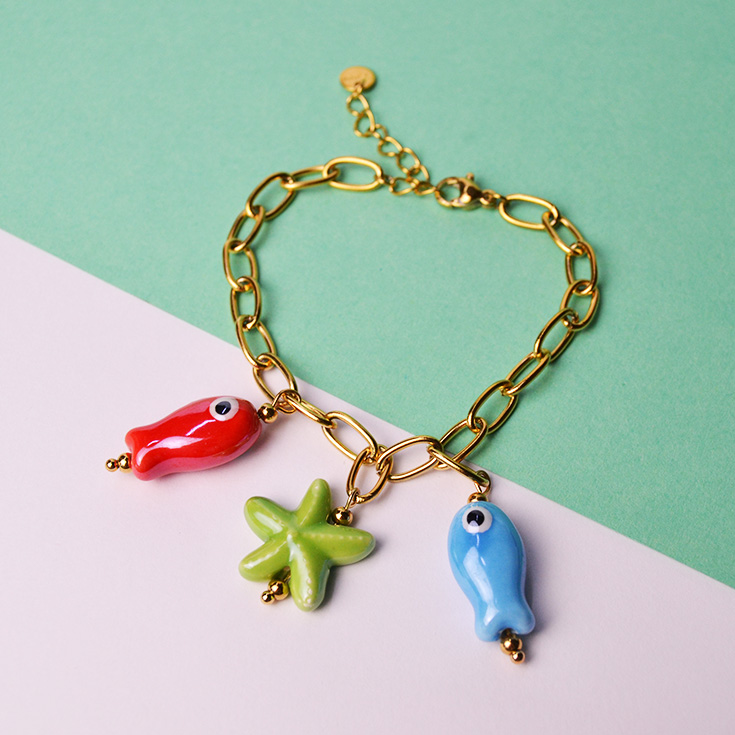 pulsera eslabones charm peces y estrella de mar
