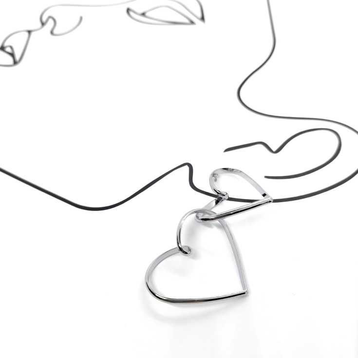 pendientes aros corazon doble entrelazado plateados