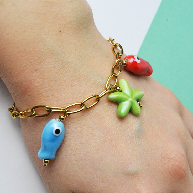 pulsera eslabones charm peces y estrella de mar