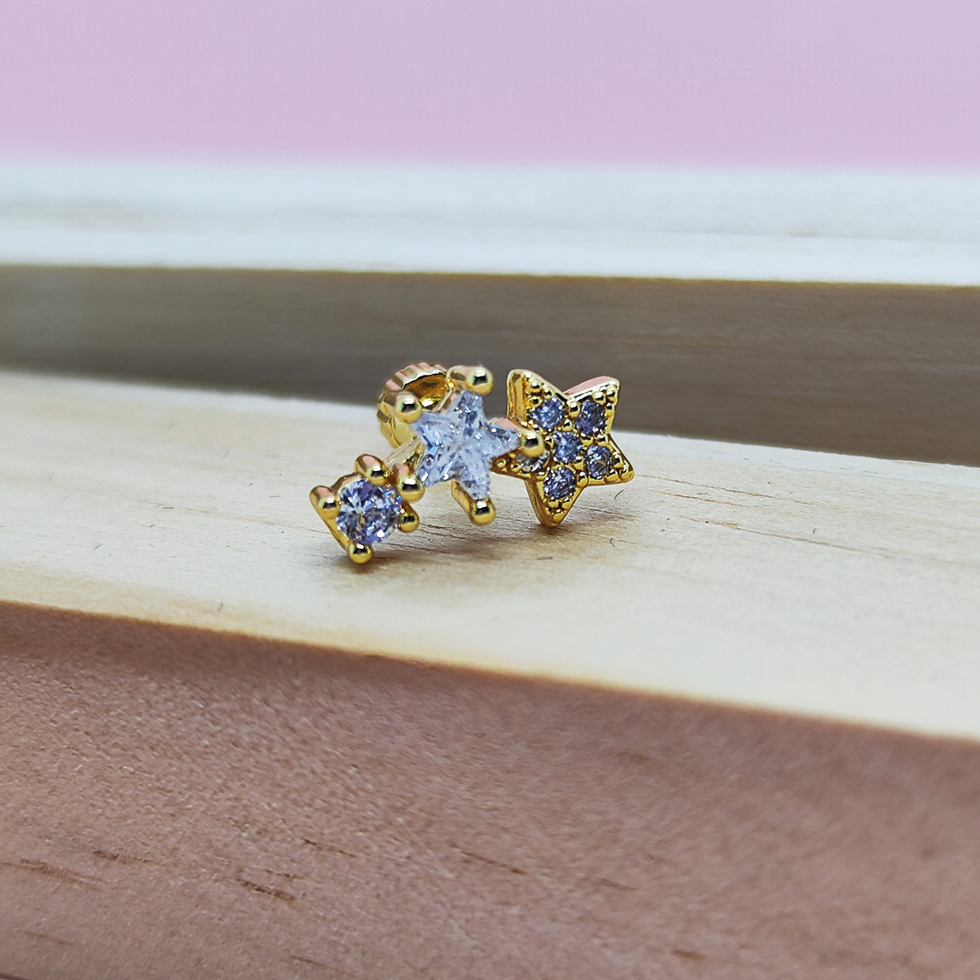 piercing dorado 3 estrellas