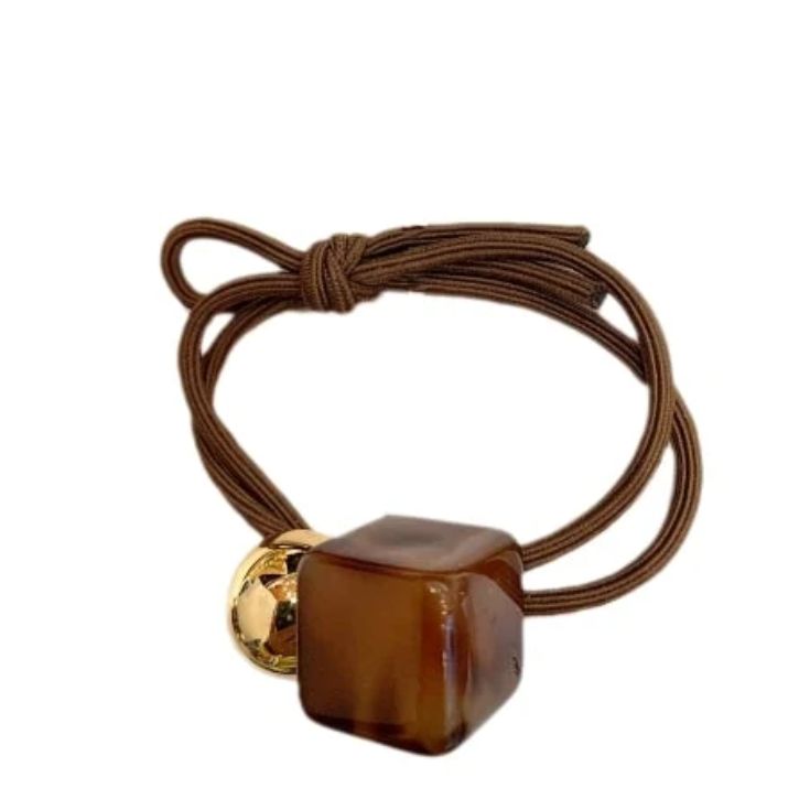 inca goma con adorno figura cubo y bola